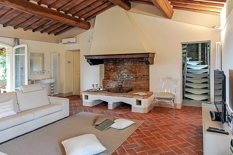 Tuscan large fireplace and refined contemporary sitting room