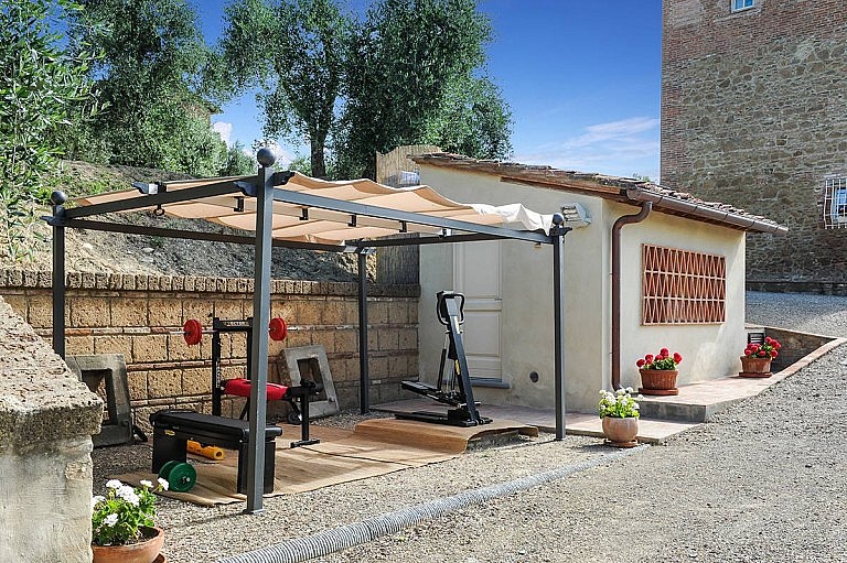Small private gym by the pool