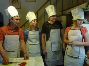A family from Finland doing a cooking class in Tuscany
