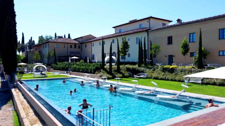 Infinity pool in the garden of wine resort near Vinci
